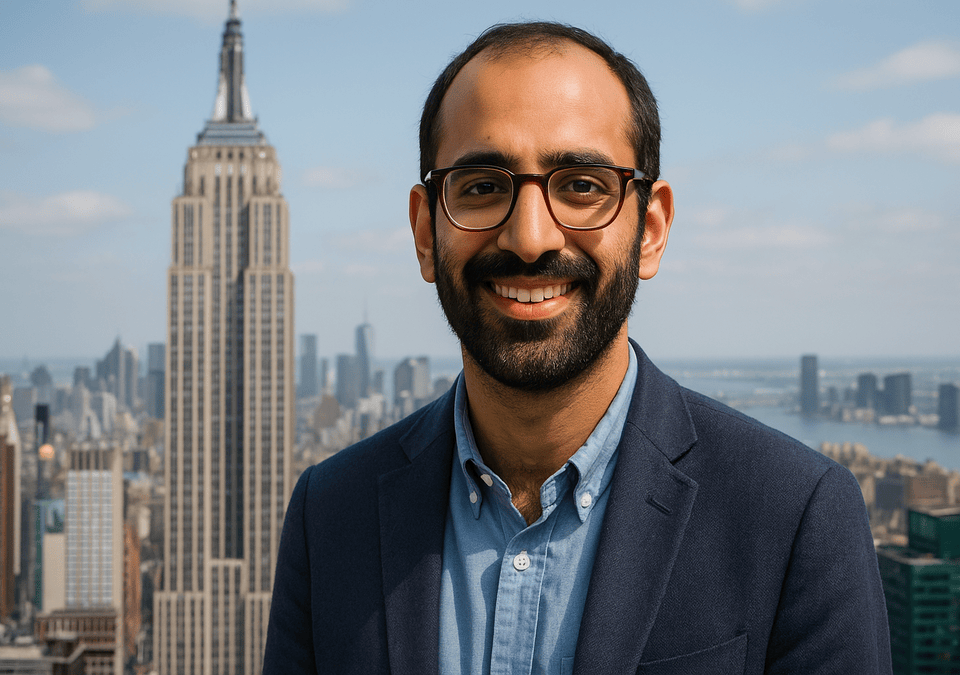 Zohran Mamdani standing in front of the Empire State Building
